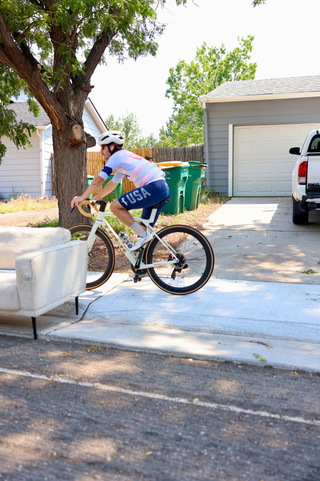 Carter Luense riding out of the neighborhood in USA kit