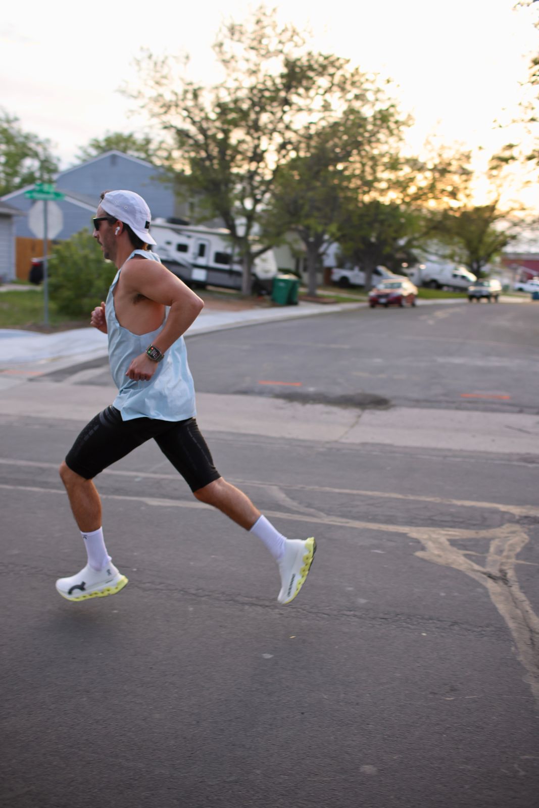 Carter Luense mid-stride at golden hour, both feet off the ground
